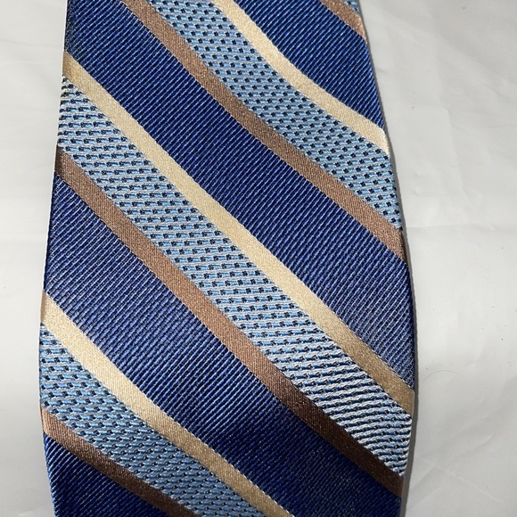 Jos A Bank men’s tie in various blues and metallic gold and tan stripes. NWT - Picture 2 of 4
